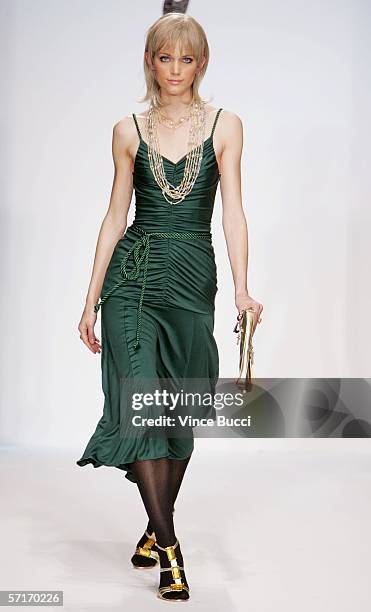 Model walks the runway at the Meghan Fall 2006 show during the Mercedes Benz Fashion Week at Smashbox Studios on March 23, 2006 in Culver City,...