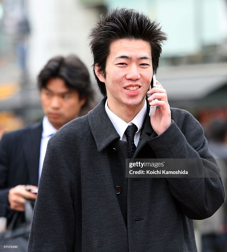 Japanese Mobile Router Man A Japanese man uses his mobile phone on March 24, 2006 in Tokyo ...