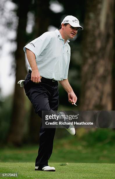 Paul Lawrie of Scotland cleans his spikes during the second round of the Madeira Island Open 2006 at Clube de Golf Santo de Serra on March 24, 2006...