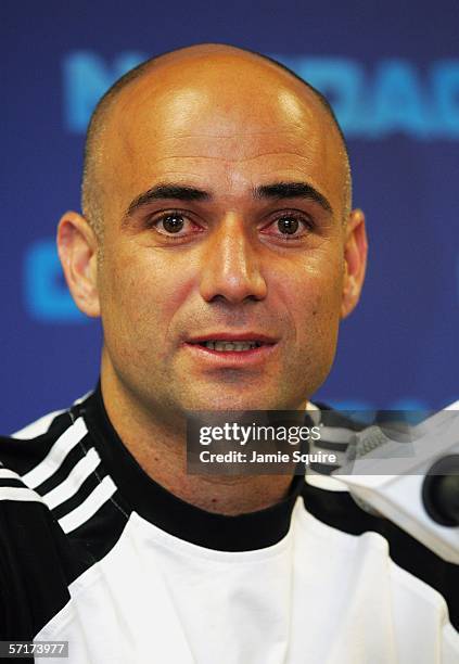 Andre Agassi speaks to the media at a press conference announcing his withdrawal from the Nasdaq-100 Open on Day 5 at the Tennis Center at Crandon...