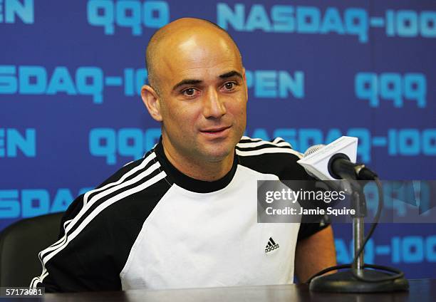 Andre Agassi speaks to the media at a press conference announcing his withdrawal from the Nasdaq-100 Open due to injury on Day 5 at the Tennis Center...