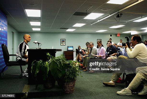 Andre Agassi speaks to the media at a press conference announcing his withdrawal from the Nasdaq-100 Open due to injury on Day 5 at the Tennis Center...