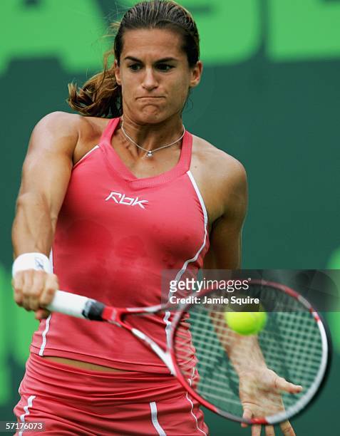 Amelie Mauresmo of France returns a backhand to Samantha Stosur of Australia in the women's second round of the Nasdaq-100 Open, part of the Sony...
