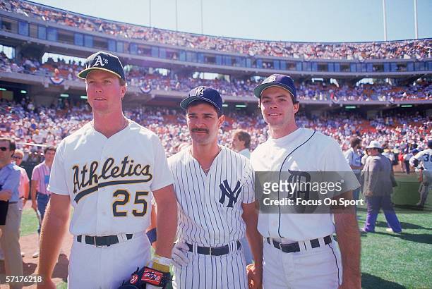 American League All Stars Mark McGwire of the Oakland Athletics, Don Mattingly of the New York Yankees, and Matt Nokes of the Detroit Tigers pose for...