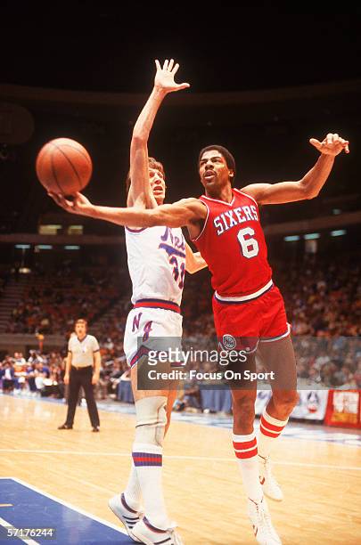 Julius Erving of the Philadelphia 76ers jumps and shoots against the New Jersey Nets circa the 1970's during a game.