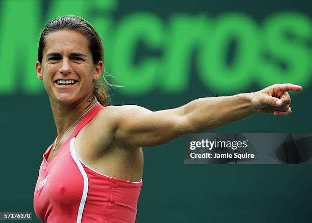 Amelie Mauresmo of France signals during her match against Samantha Stosur of Australia in the women's second round of the Nasdaq-100 Open, part of...