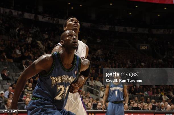 Kevin Garnett of the Minnesota Timberwolves boxes out Chris Bosh of the Toronto Raptors on March 24, 2006 at the Air Canada Centre in Toronto,...