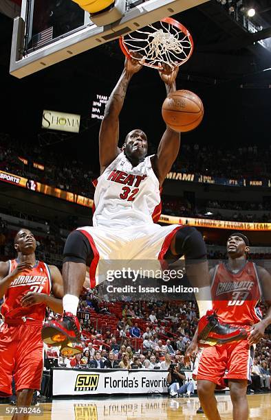 Shaquille O'Neal of the Miami Heat dunks against the Charlotte Bobcats on March 24, 2006 at American Airlines Arena in Miami, Florida. NOTE TO USER:...