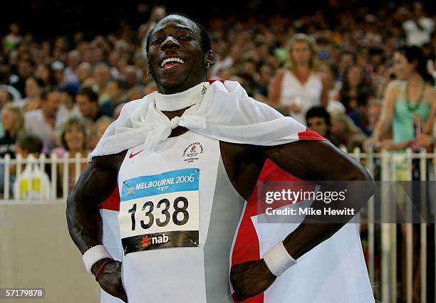 Phillips Idowu of England celebrates winning the men's Triple Jump final at the athletics during day ten of the Melbourne 2006 Commonwealth Games at...