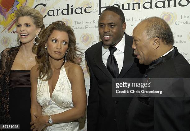 Shawn Southwick-King, actress/singer Vanessa Williams, improvisational comedian Wayne Brady, and singer Quincy Jones share a laugh while posing for...