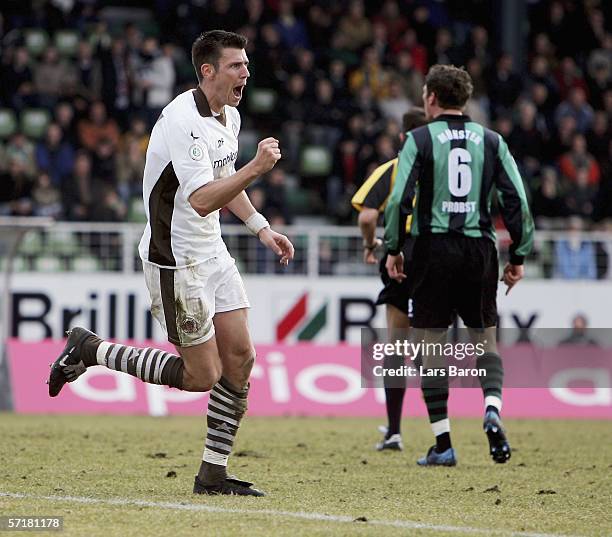 Fabian Boll of St. Pauli celebrates scoring the second goal during the match of the Third League between SC Preussen Muenster and FC St. Pauli at the...