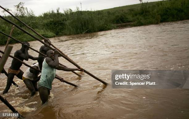 Men and boys mine for gold in a river March 24, 2006 in Bunia, Congo. Gold deposits, which are numerous in the volatile north-east of the country,...