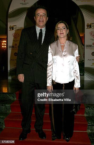 Actor Christian De Sica and his wife Silvia Verdone arrive at the Hotel Billia to attend 'Grolle d'Oro' Italian Movie Awards on March 25, 2006 in...