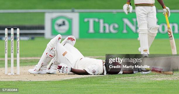 Brian Lara of the West Indies falls after dodging a bouncer from Shane Bond of the Black Caps during day two of the third test match between New...