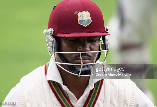 Brian Lara of the West Indies walks from the field after being clean bowled by Nathan Astle of the New Zealand Black Caps for 83 runs during day two...