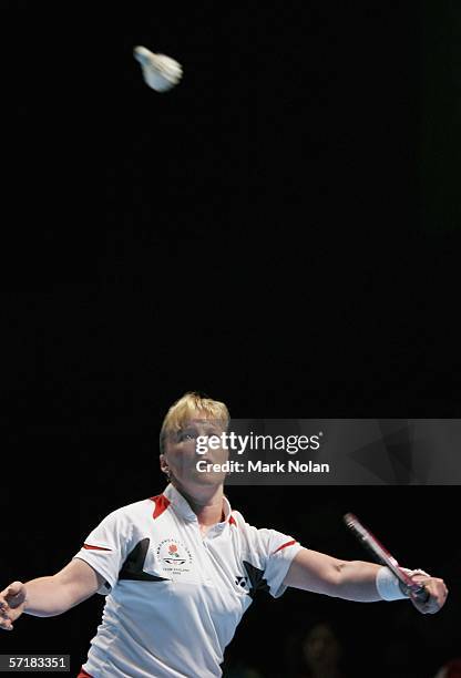 Tracey Jayne Hallam of England hits a return to Mew Choo Wong of Malaysia during the final of the women's singles badminton match on day eleven of...