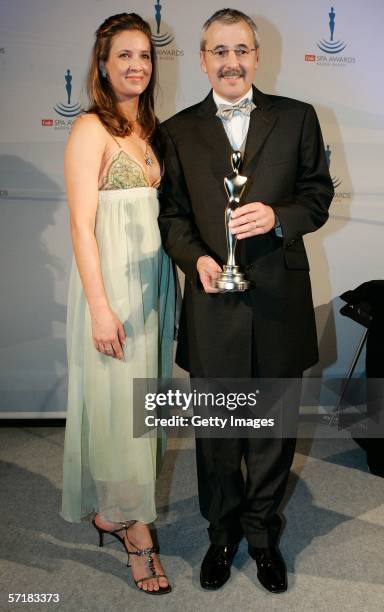 Dana Schweiger hands over the Gala Spa Award to Gerd Weiler, head of Cosmetique Active, during the Gala Spa Awards 2006 on March 25, 2006 in...