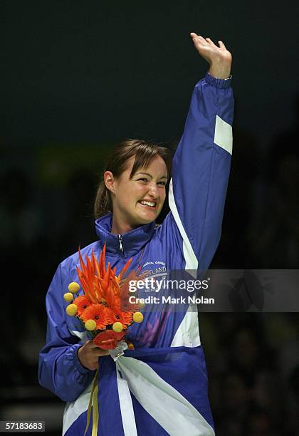 Susan Hughes of Scotland poses for a picture during the medal ceremony for the women's singles badminton match on day eleven of the Melbourne 2006...