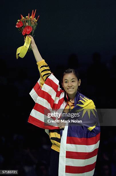 Mew Choo Wong of Malaysia poses for a picture during the medal ceremony for the women's singles badminton match on day eleven of the Melbourne 2006...