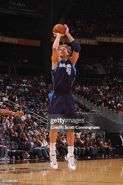 Dirk Nowitzki of the Dallas Mavericks shoots against the Atlanta Hawks during a game on March 25, 2006 at Philips Arena in Atlanta, Georgia. NOTE TO...