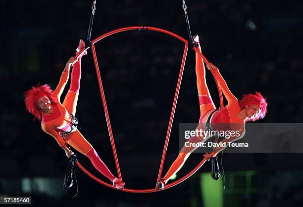 Acrobats are lowered into the stadium during the Closing Ceremony for the Melbourne 2006 Commonwealth Games at the Melbourne Cricket Ground March 26,...