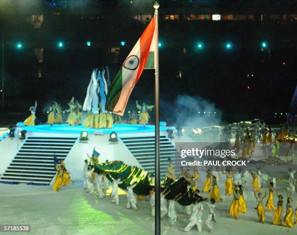 The Indian flag flies over the grounds of the Melbourne Cricket Ground as a Bollywood performance takes place to mark the next Commonwealth Games in...