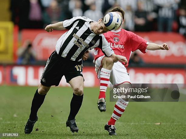 Scott Parker of Newcastle United battles for the ball with Matt Holland of Charlton Athletic during the Barclays Premiership match between Charlton...
