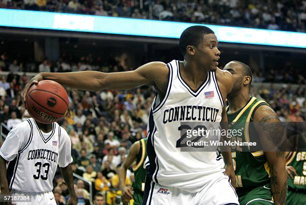 Rudy Gay of the Connecticut Huskies looks to pass the ball against the George Mason Patriots during the Regional Finals of the NCAA Men's Basketball...
