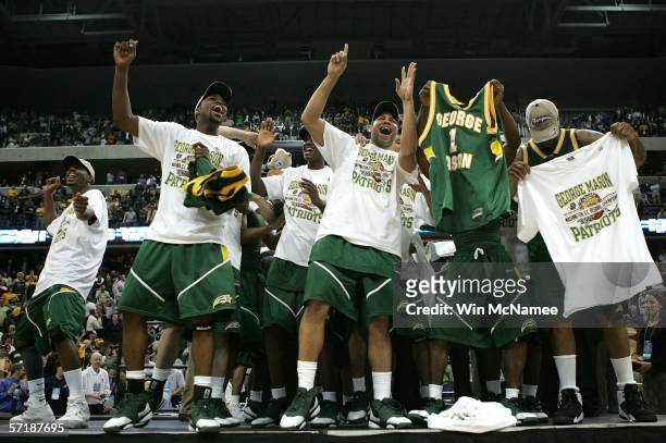 The George Mason Patriots celebrate their win over the Connecticut Huskies during the Regional Finals of the NCAA Men's Basketball Tournament on...