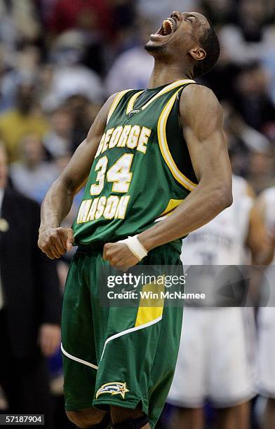 Will Thomas of the George Mason Patriots celebrates during fourth quarter action against Connecticut during the Regional Finals of the NCAA Men's...