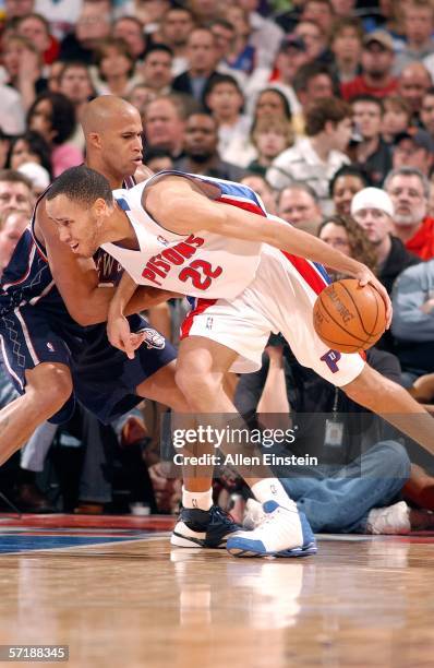 Tayshaun Prince of the Detroit Pistons battles towards the net against Richard Jefferson of the New Jersey Nets in a game on March 26, 2006 at the...