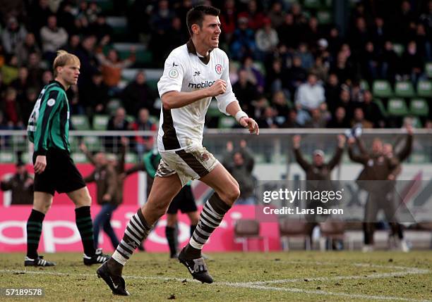 Fabian Boll of St. Pauli celebrates scoring the second goal during the match of the Third League between SC Preussen Muenster and FC St. Pauli at the...