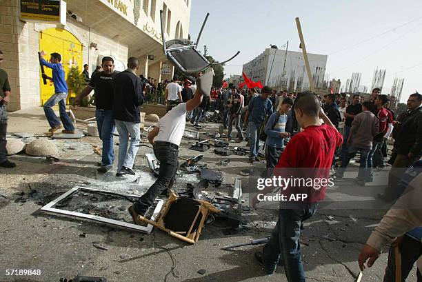 Palestinian smashes a chair outside British Cultural center after it was ransacked in the West Bank city of Ramallah 14 March 2006, as Palestinians...