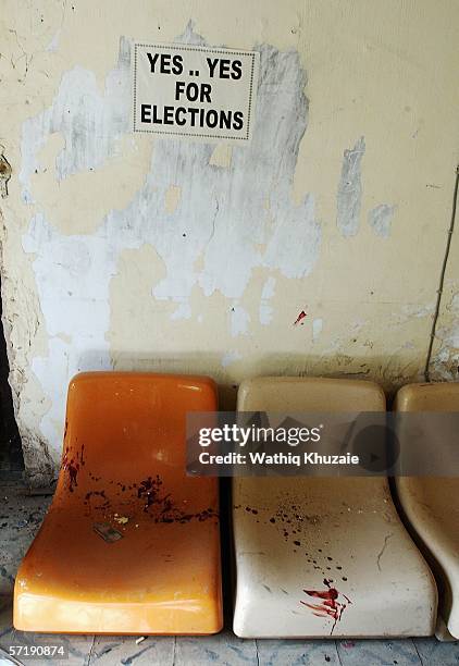 Blood stains the Mustafa Shiite mosque next to a poster reading "yes yes for elections" on March 27, 2006 northeast of Baghdad, Iraq. 20 Iraqis were...