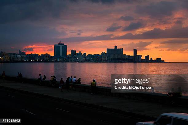 sunset at malecon in la havana, cuba - la habana stock pictures, royalty-free photos & images