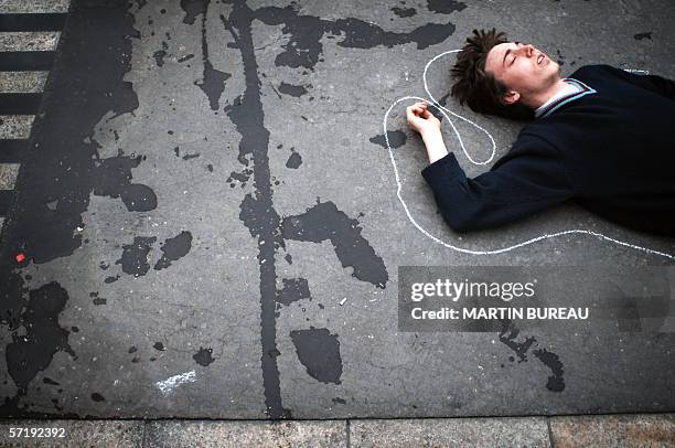 Student lies on the ground during a protest action over the government's contested youth job plan, the First Employment Contract , 27 March 2006 in...