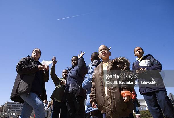 Onlookers watch as elephants walk along Massachusetts Avenue during a parade from the DC Armory to the Verizon Center March 27, 2006 in Washington,...