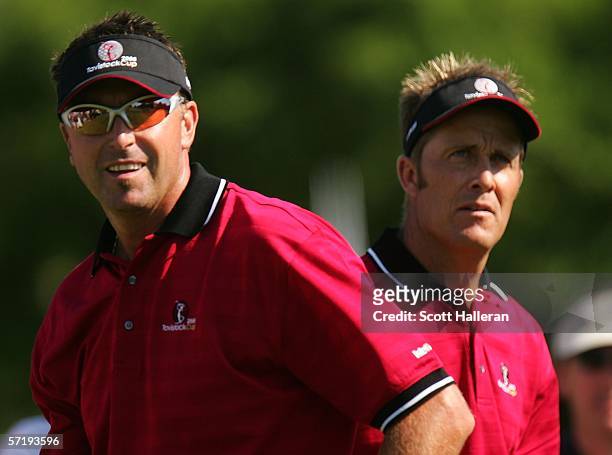 Teammates Robert Allenby and Stuart Appleby of Australia wait on the 12th hole during the first day of the Tavistock Cup on March 27, 2006 at the...