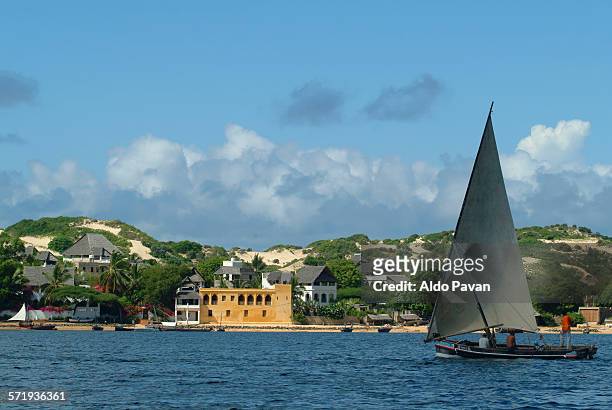 sailing boat in front at the town - lamu kenya stock pictures, royalty-free photos & images