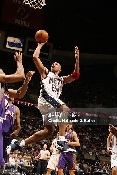 Richard Jefferson of the New Jersey Nets shoots against Shawn Marion of the Phoenix Suns on March 27, 2006 at the Continental Airlines Arena in East...