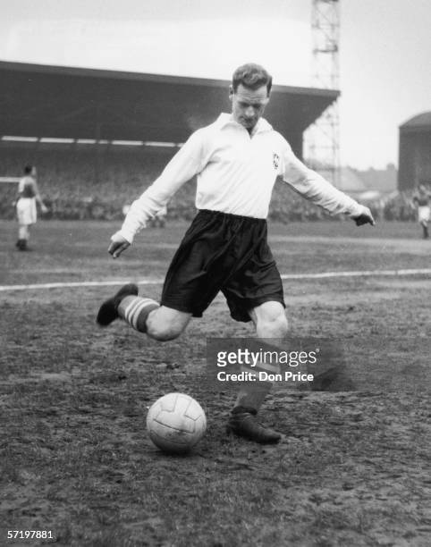 Preston North End footballer Tom Finney warming up before a match, 22nd January 1955. Original Publication - Picture Post - 7494 - Tom Finney Of...