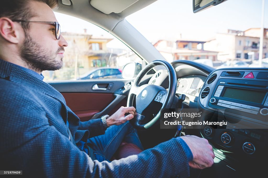 Young man driving car