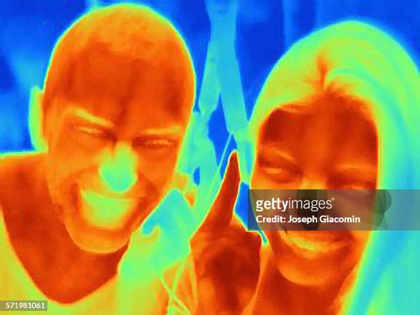 thermal photograph of young couple smiling - 熱映像 ストックフォトと画像