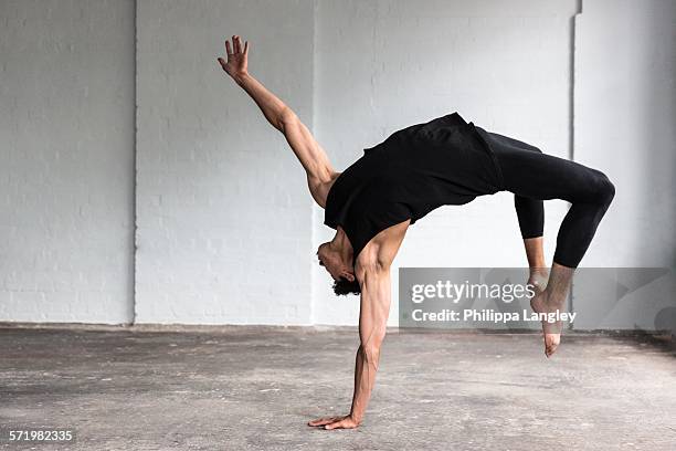 dancer practising in studio - legging stock-fotos und bilder