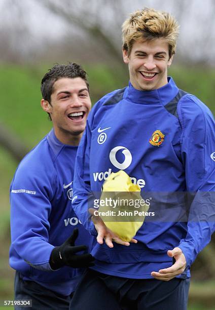 Gerard Pique and Cristiano Ronaldo of Manchester United in action during a first team training session at Carrington Training Ground on March 28...