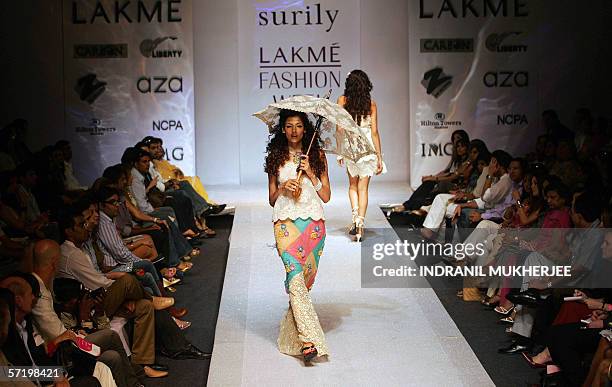 Model displays a creation by designer Surily Goel on the first day of the inaugural Lakme Fashion Week in Mumbai, 28 March 2006. The first of two...