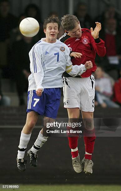 Janne Tormanen of Finland goes up for a header with Florian Jungwirth of Germany during the Men's Under 17 European Championship qualifier match...