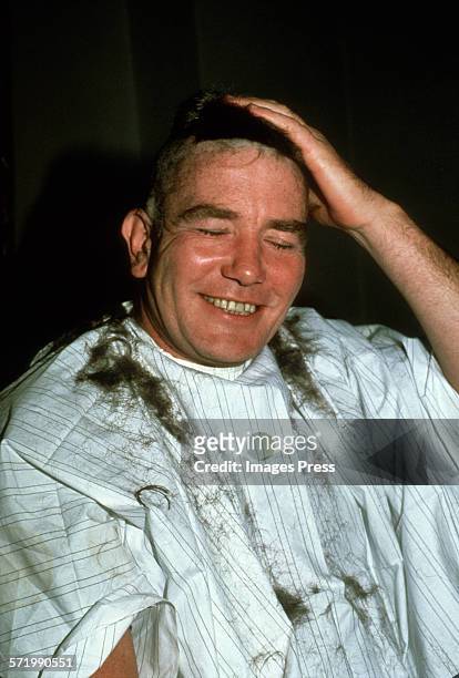 Albert Finney goes bald circa 1981 in New York City.