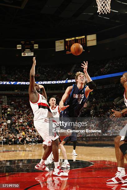 Dirk Nowitzki of the Dallas Mavericks goes to the basket against Zach Randolph of the Portland Trail Blazers during the game at the Rose Garden on...