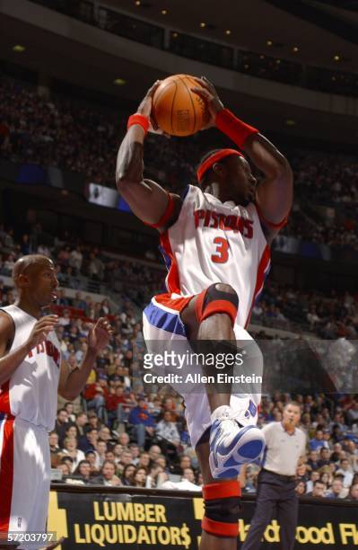 Ben Wallace of the Detroit Pistons rebounds in front of teammate Chauncey Billups during their game against the Dallas Mavericks at the Palace of...